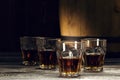 brandy in decanters stand on an oak barrel