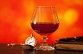 Brandy glass, diary and pocket watch Royalty Free Stock Photo