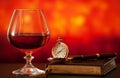 Brandy glass, diary and pocket watch Royalty Free Stock Photo