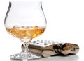 Brandy glass and hip flask Royalty Free Stock Photo