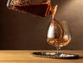 Brandy is poured into a snifter glass Royalty Free Stock Photo