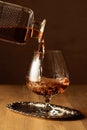 Brandy is poured into a snifter glass Royalty Free Stock Photo