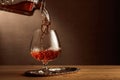 Brandy is poured into a snifter glass Royalty Free Stock Photo
