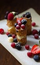 Brandy snaps with white chocolate mousse and summer berries