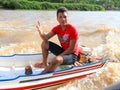 Brazil: Boy in a Motor Boat Royalty Free Stock Photo