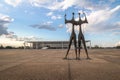 Candangos or Warriors Sculpture at Three Powers Plaza with Planalto Palace on background - Brasilia, Distrito Federal, Brazil