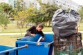 A Poor Homeless Indigenous Woman Picking through the Trash
