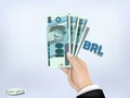 Brasilian reals money paper on hand,cash on hand Royalty Free Stock Photo