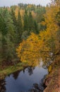 Brasla river running through red sandstone rocks grown by green and yellow forest in autumn. Royalty Free Stock Photo