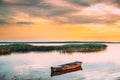 Braslaw Or Braslau, Vitebsk Voblast, Belarus. Wooden Rowing Fishing Boat In Beautiful Summer Sunset On The Dryvyaty Lake Royalty Free Stock Photo