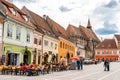 Brasov Republicii street and Council square in the evening during spring season . The most important street and sqaure in the