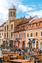 Brasov Republicii street and Council square in the evening during spring season . The most important street and sqaure in the