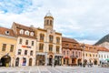 Brasov Republicii street and Council square in the evening during spring season . The most important street and sqaure in the