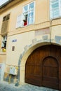 Brasov, Romania: Antique wooden door. Street of Brasov city in Romania. Brasov sits in Transylvania region of Romania