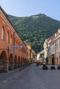 City name Brasov written with huge white letters on Mount Tampa is seen from the narrow streets of the old town