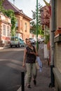 Brasov, Romania - July 08, 2022: Woman on the street, Beautiful city center of the largest city in Transylvania. Royalty Free Stock Photo