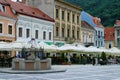 Terraces with tourists and residents in the Council Square of Brasov.