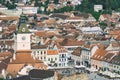 Brasov city hall clock tower located in the old town Council Square. View from above Royalty Free Stock Photo