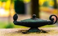 Brass Aladdin lamp sculpture.