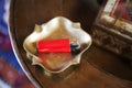 Brass ashtray red lighter round table Royalty Free Stock Photo