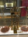 A brass balance scale, by Howard and Davis of Boston.