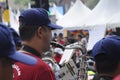 Brass band players playing a musical instrument while Royalty Free Stock Photo