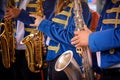 Close-up of a group of saxophonists in the foreground