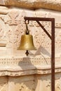 Brass bell at the entrance of a temple in Narlai, India