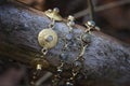 Brass bracelets with labradorite stone on wooden background Royalty Free Stock Photo
