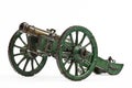 Brass cannon on green painted carriage old vintage isolated on w Royalty Free Stock Photo