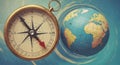A brass compass with a red and black needle is positioned beside a globe against a Royalty Free Stock Photo