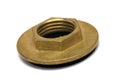 A Brass copper hexagonal flange nut with a black rubber seal underneath white backdrop Royalty Free Stock Photo