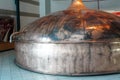 Brass fermentation vessels on display at the South African Brewery