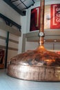 Brass fermentation vessels on display at the South African Brewery