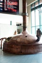 Brass fermentation vessels on display at the South African Brewery