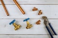 Brass gate valve, monkey wrench brass plumbing fittings on wooden background Royalty Free Stock Photo