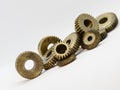 Brass gears positioned diagonally on the background