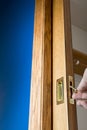 Brass handle and edge pull on a wooden pocket door