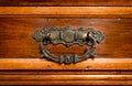 Brass handle hand made of an antique drawer. Royalty Free Stock Photo