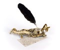 Brass inkwell with feather and letter Royalty Free Stock Photo