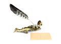 Brass inkwell with feather and postcard Royalty Free Stock Photo