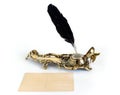 Brass inkwell with feather and postcard Royalty Free Stock Photo