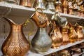 Brass jugs at shelf of souvenir store