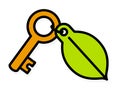 Brass key with a green environment leaf tag Royalty Free Stock Photo