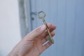 Old vintage brass door Key in mans hand Royalty Free Stock Photo