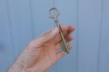 Old vintage brass door Key in mans hand Royalty Free Stock Photo