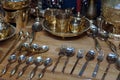 Brass kitchenware,Brass spoons, forks and knives on wood table background