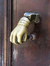 Brass knocker in the shape of your hand Royalty Free Stock Photo