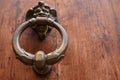 Brass knocker on wood door Royalty Free Stock Photo