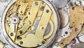 Brass mechanical watch on heap of spare parts